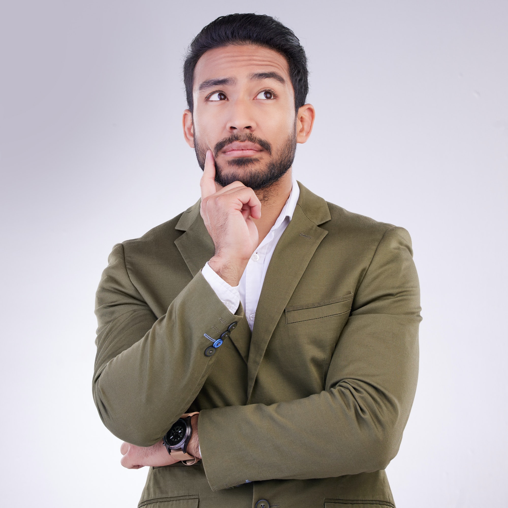 Business man, thinking face and planning in studio with ideas or strategy on a gray background. Asi